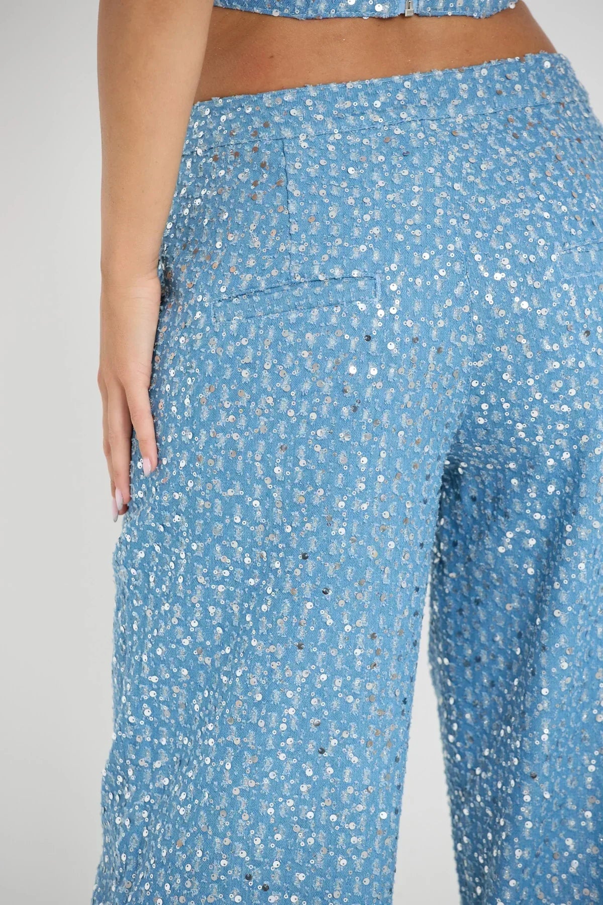 Blue tube top with sequins and wide leg pants with glitter
