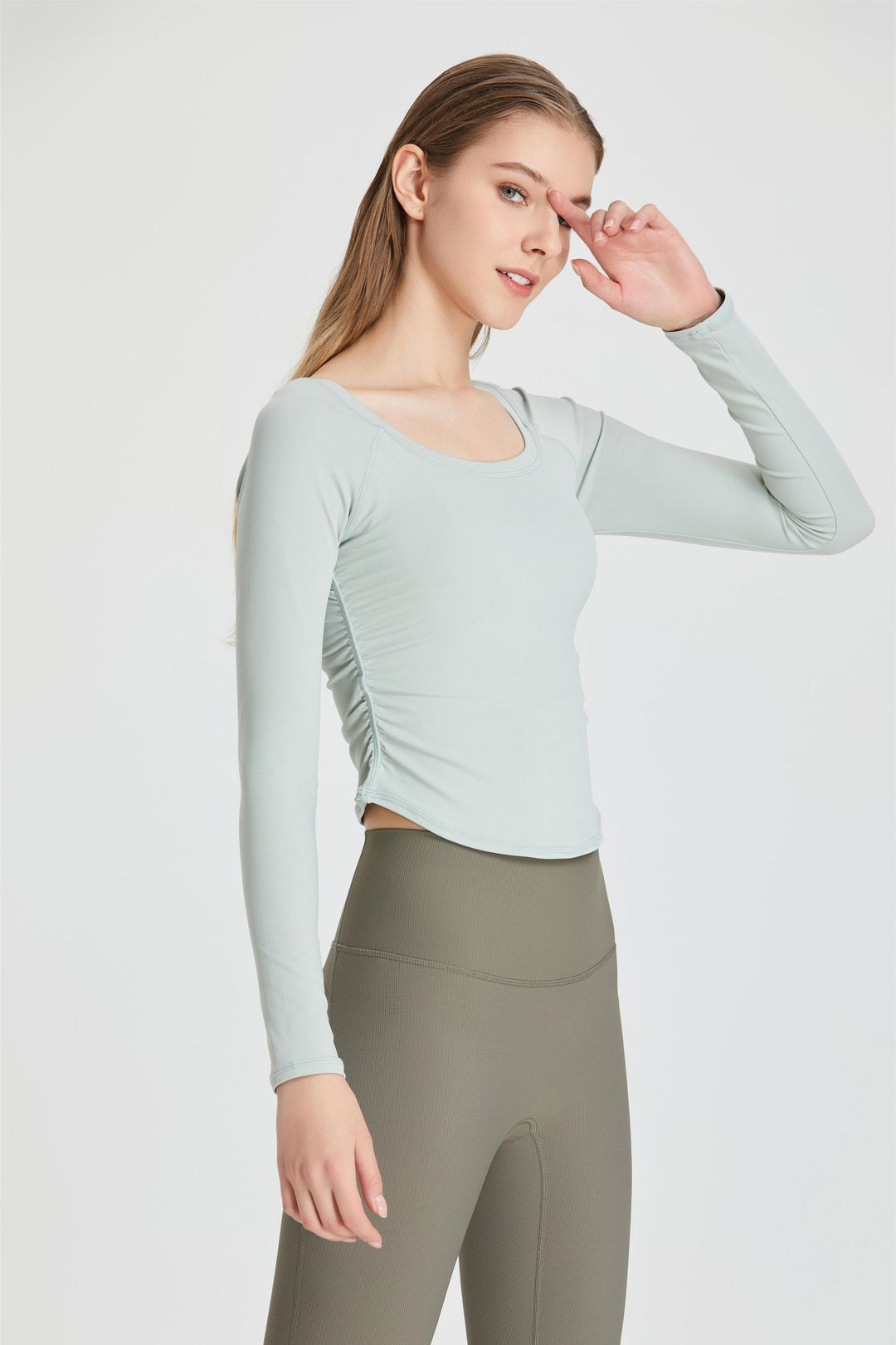 Top with long sleeves and ruffles on the sides